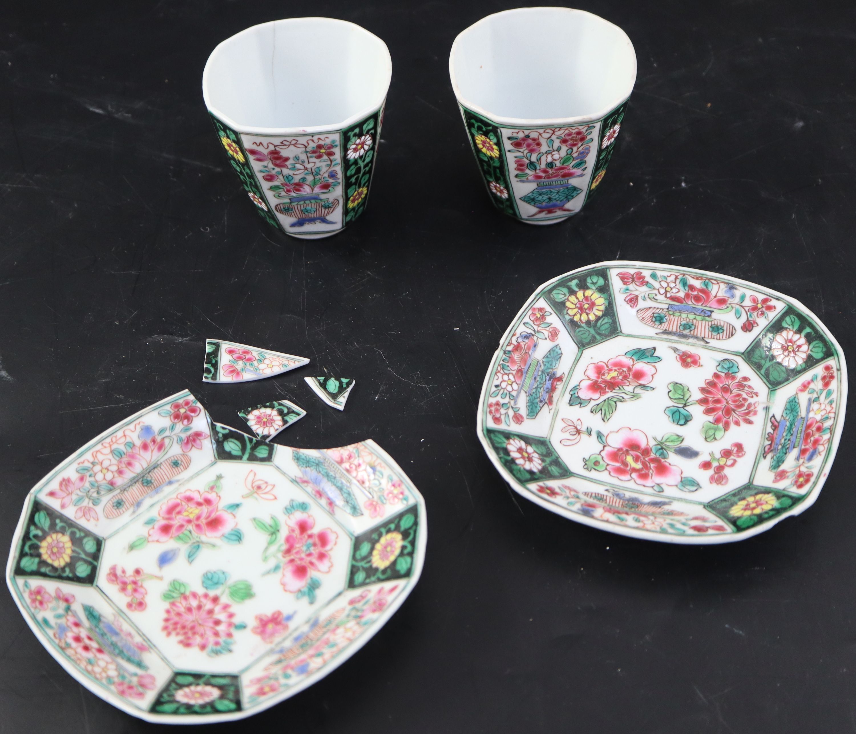 A pair of Chinese Qianlong famille rose octagonal cups and saucers, saucers 12cm cups height 6.5cm diameter 6.75cm